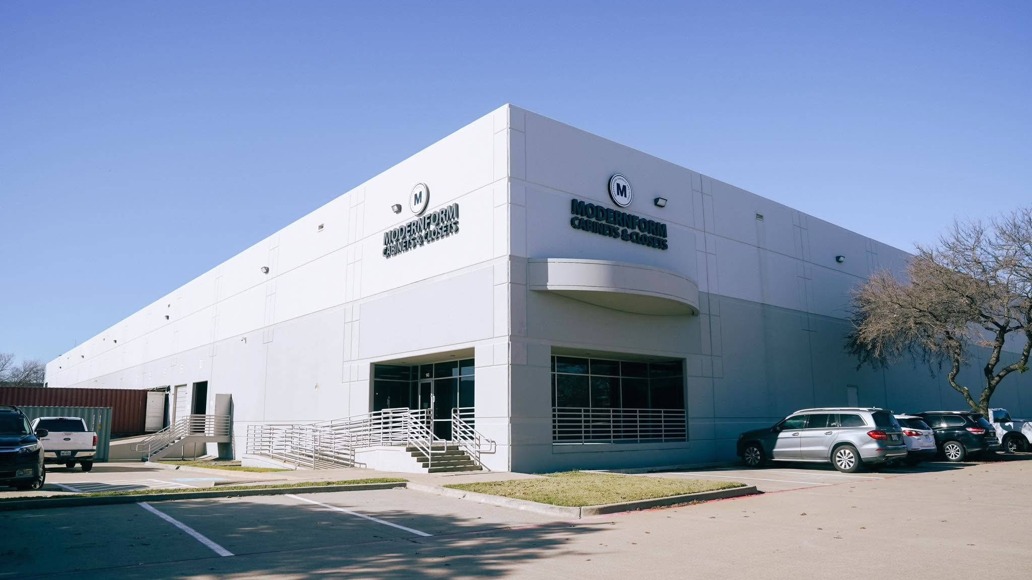 Front exterior of the Modernform Cabinets and Closets showroom building located in Carrollton, Texas.